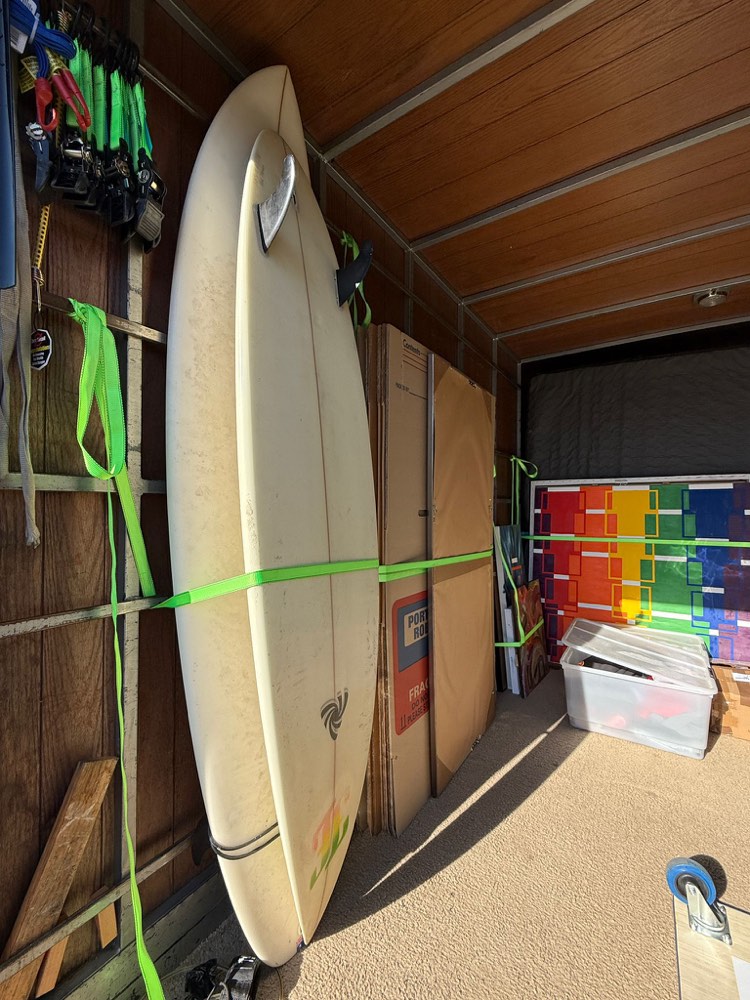 Surfboards, artwork and boxes strapped securely inside the BKS truck